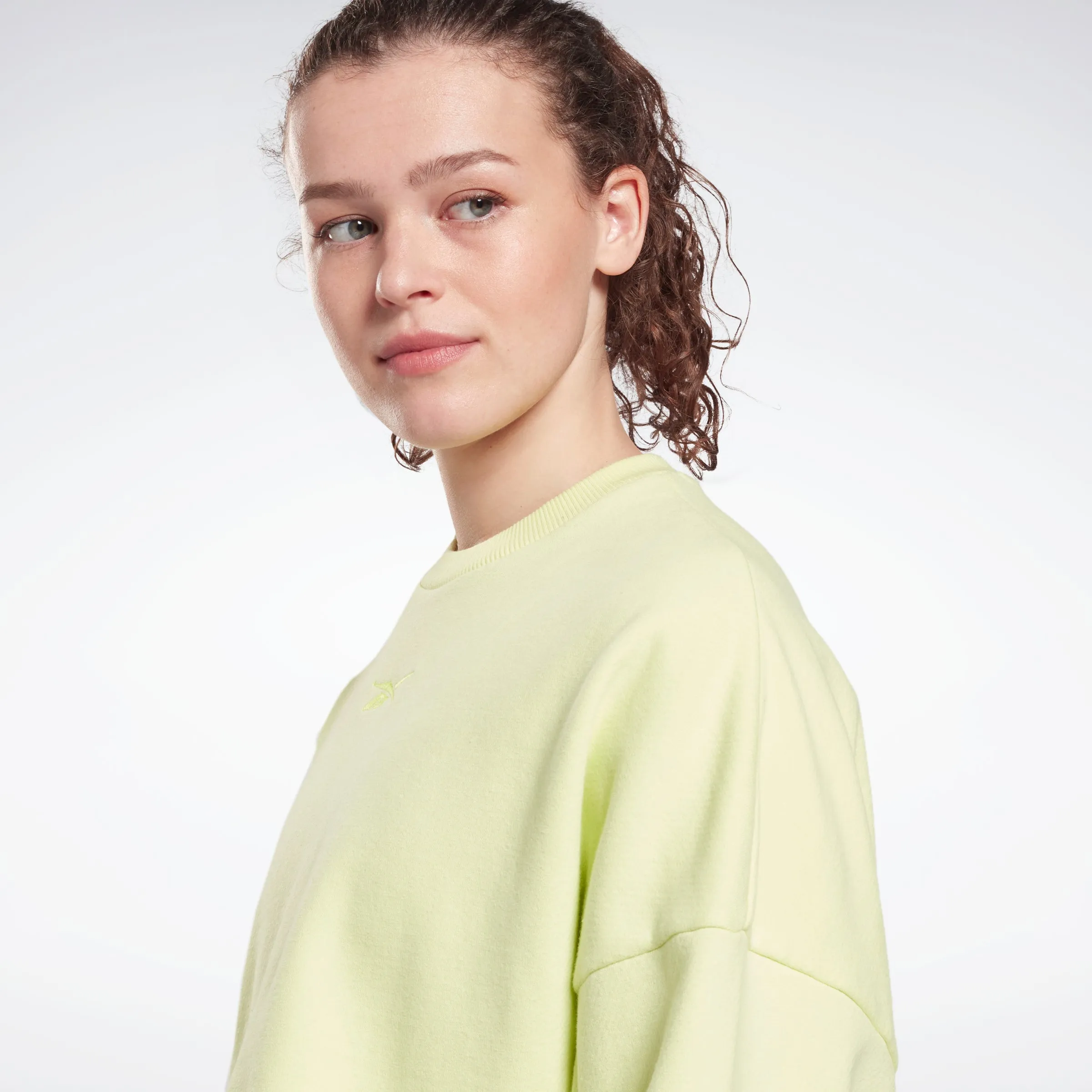 Reebok Apparel Women Studio Cropped French Terry Crew Sweatshirt Eneglw